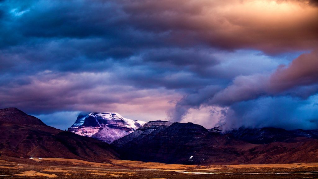 Sacred Mount Kailash under dramatic changing sky in Tibet